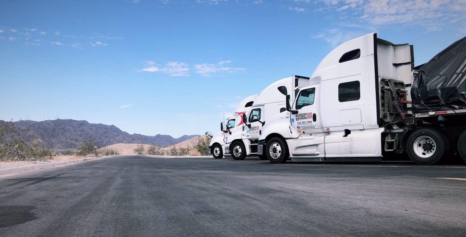 Patriot Express tractors staged on a desert highway